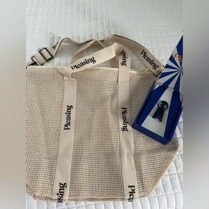 Harry Styles Pleasing Beach Bag in Black (2) & Navy Pleasing Nail Polish (1)